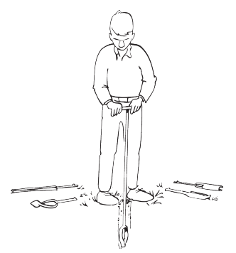 man using an auger